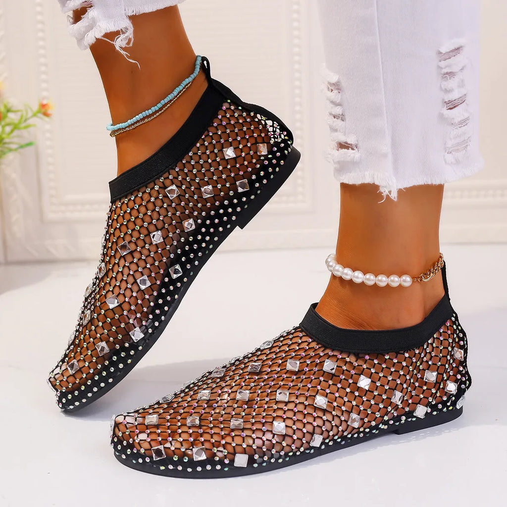Women's colourful rhinestone flat sandals with mesh upper and rubber sole.