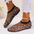 Women's colourful rhinestone flat sandals with mesh upper and rubber sole.