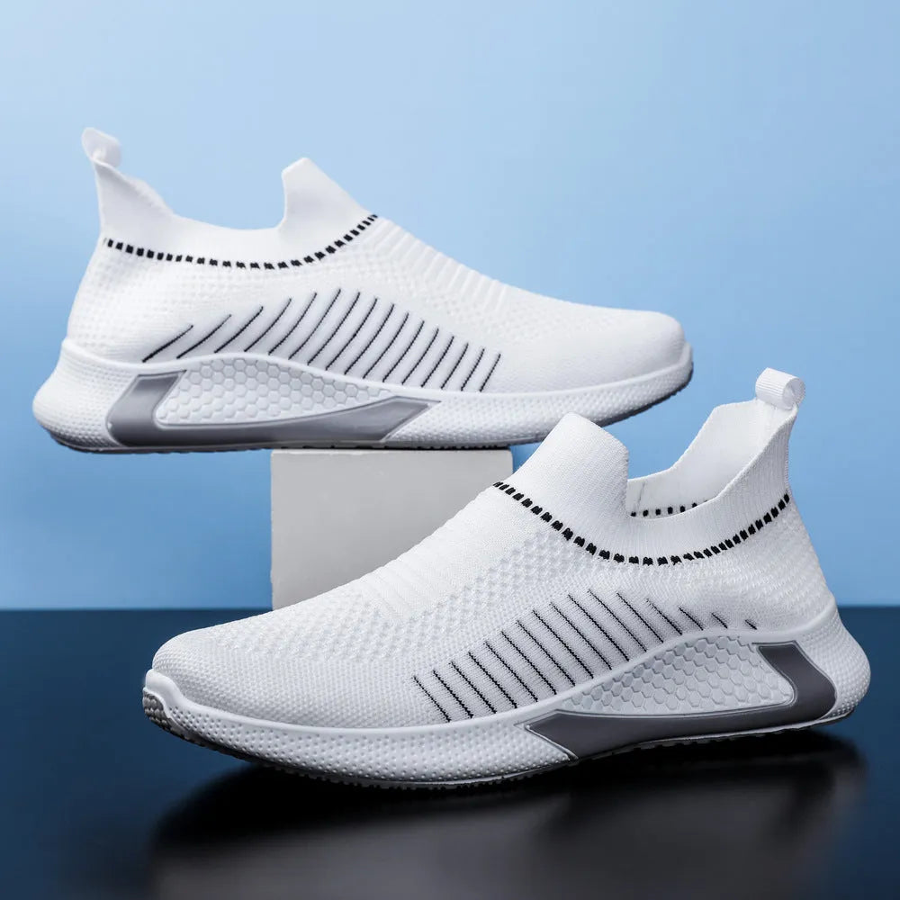 Men's low-cut sneakers with striped Flyknit upper, mesh lining, and flat plastic sole.