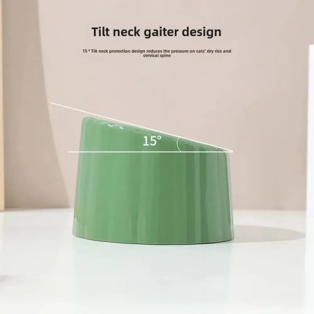 Solid green cat bowl with cactus pattern and anti-slip base on a kitchen floor.