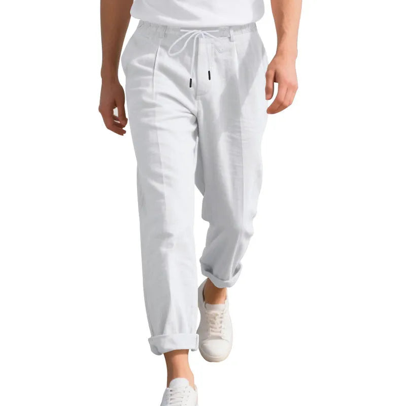 Men's light khaki linen trousers with a drawstring waist and straight leg on a hanger.