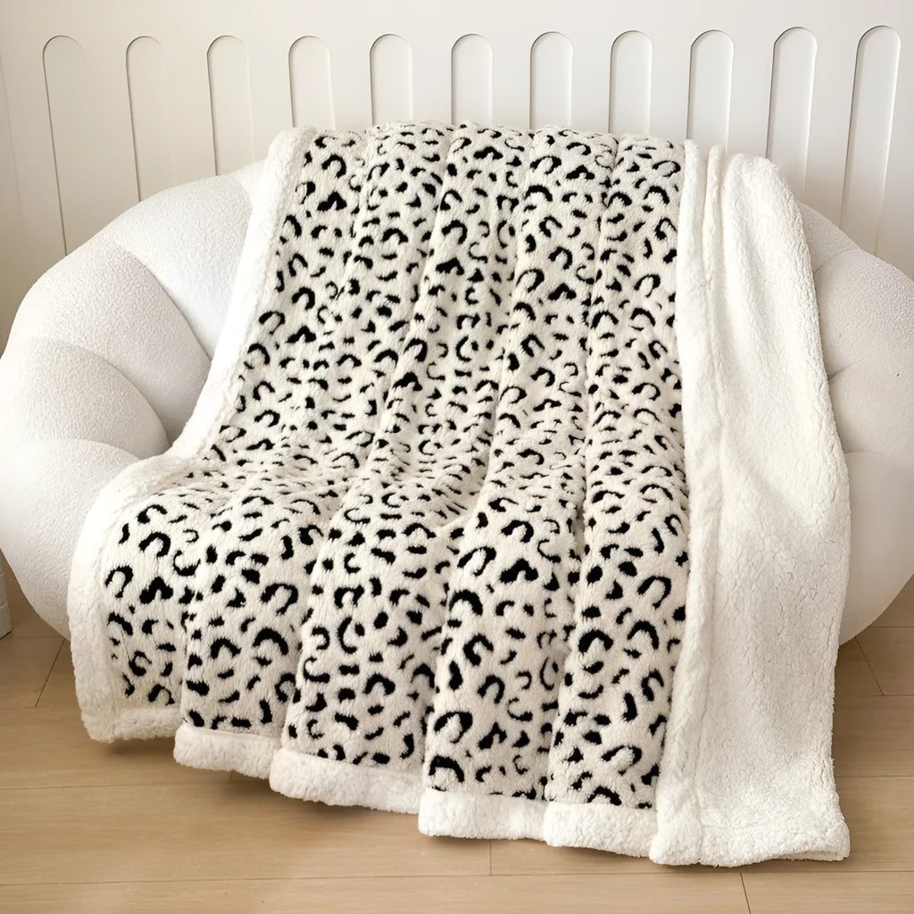 Double-layer cationic jacquard taffeta blanket with leopard print pattern in camel colour.