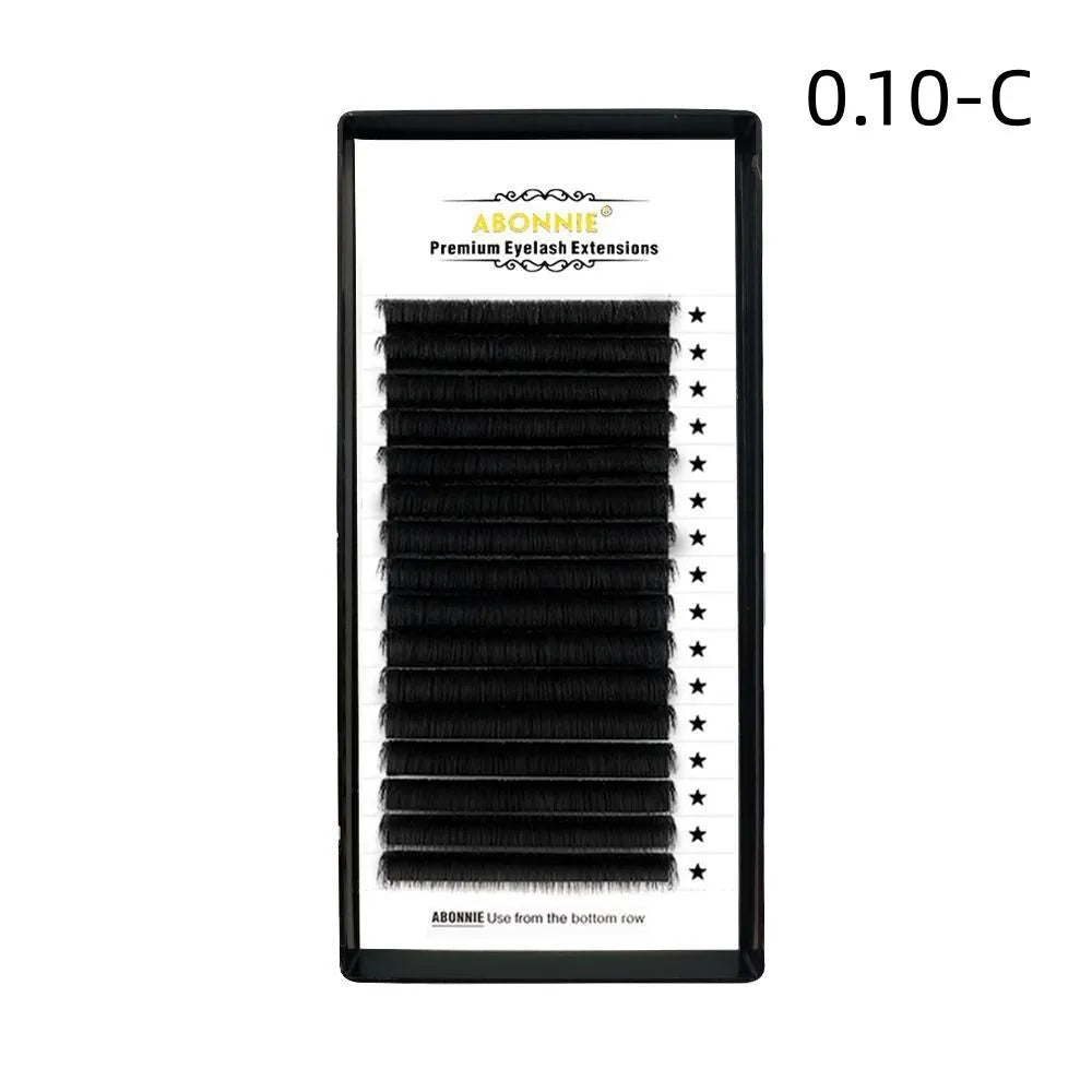 Close-up of 16-row dense mink hair false eyelashes on a matte round wool band.