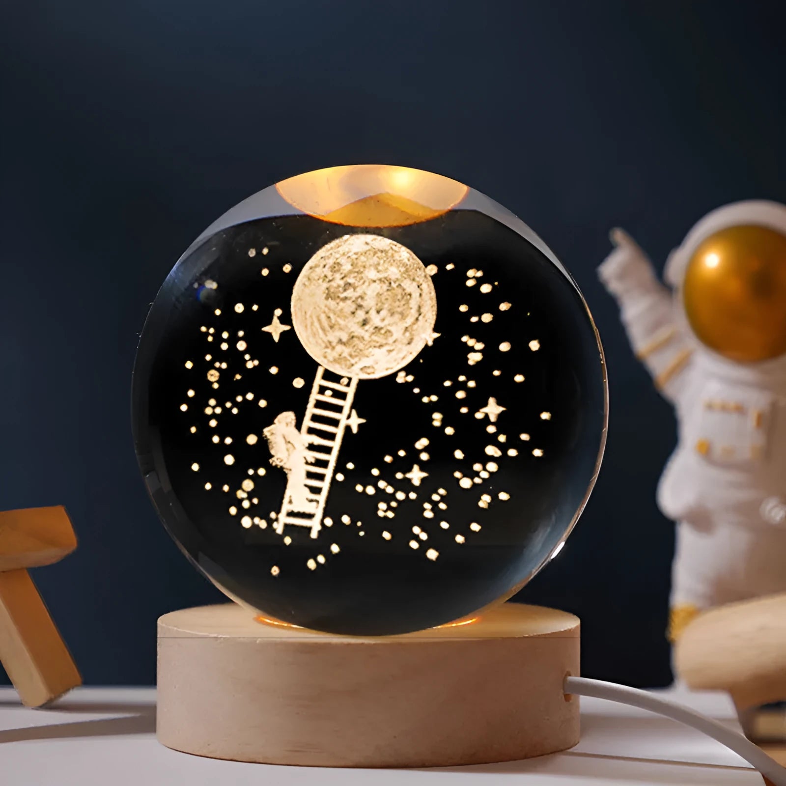 Crystal ball on wooden base with internal starry sky LED illumination for desktop decoration