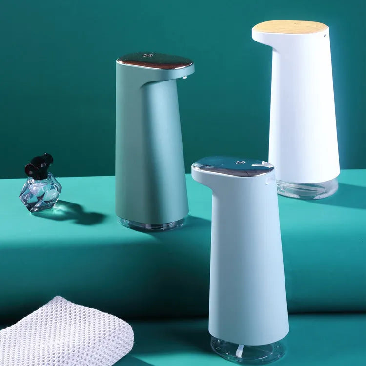 White automatic foam soap dispenser with infrared sensor on a bathroom countertop