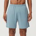 Men's sky green quick-dry double-layer running shorts with a mid-waist, laid flat.