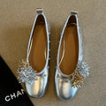 Silver DIY flower rivet Mary Jane shoes with a buckle, showing the round toe and flat rubber sole.