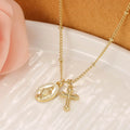 Gold geometric cross necklace with Virgin Mary detail on a 60cm chain, pendant is 3cm tall.