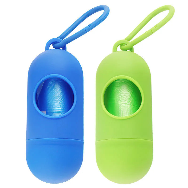 A black rectangular dog poop bag holder with a side metal hook and a grey Velcro strap, showing its compact size.