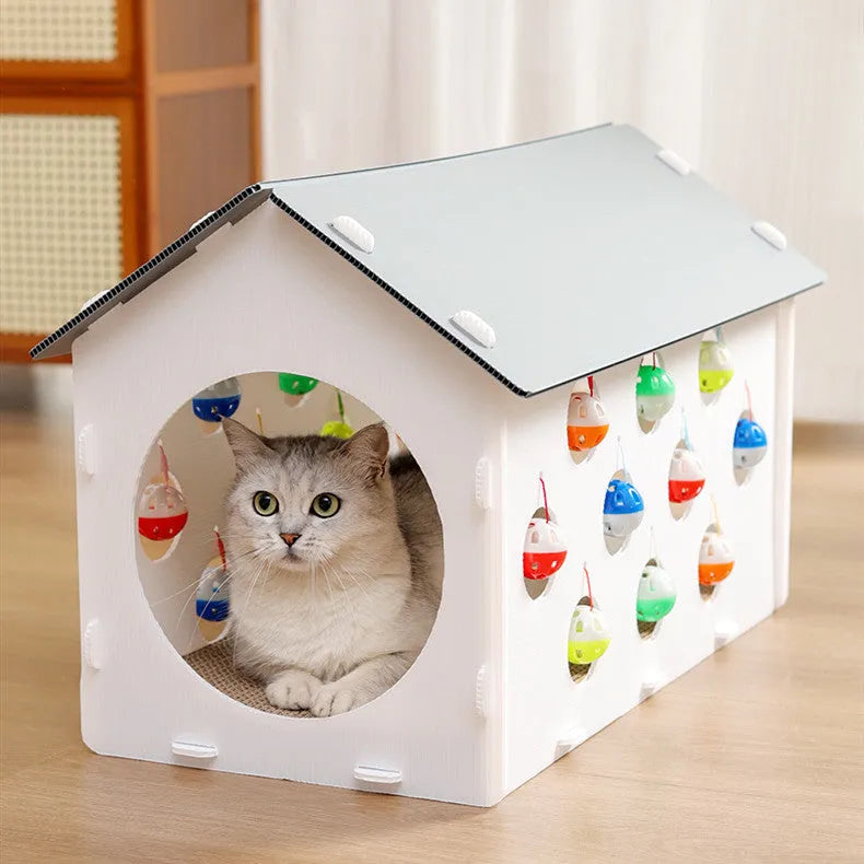 Grey integrated cat furniture with sisal scratching panel, plush-lined round nest, and tunnel with dangling bell ball toy.