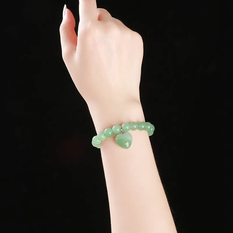 Natural stone bracelet with geometric love pendant in tigereye, crystal, aventurine, jade, and unakite stones