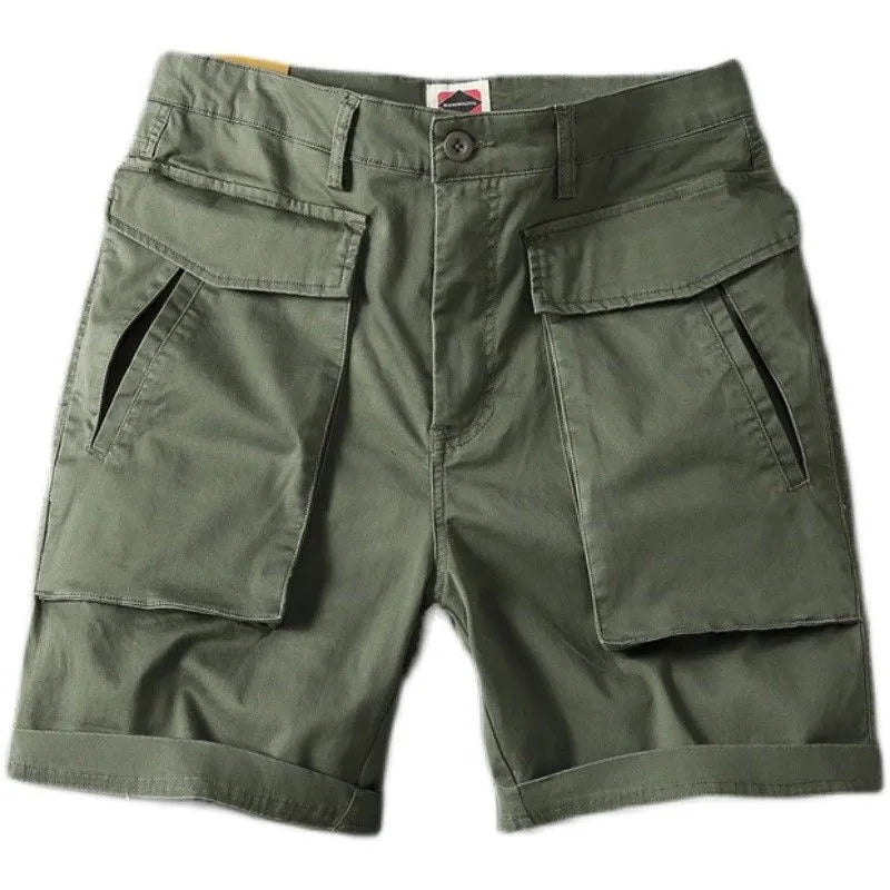 Men's beige cotton cargo shorts with multiple pockets on a straight-leg fit, shown on a neutral background.