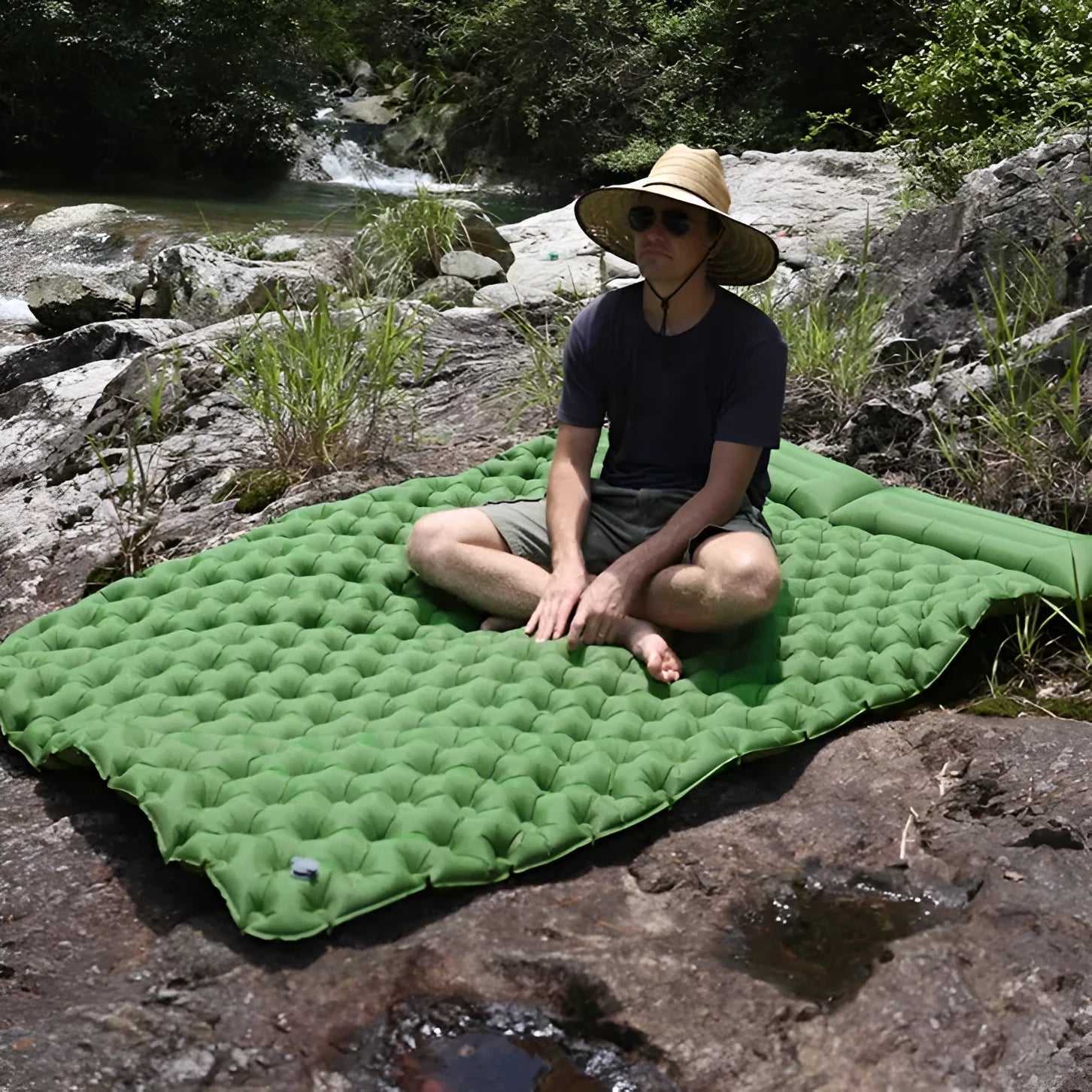 Double camping air mattress inflated, showing widened design and colour options including army green and dark blue.
