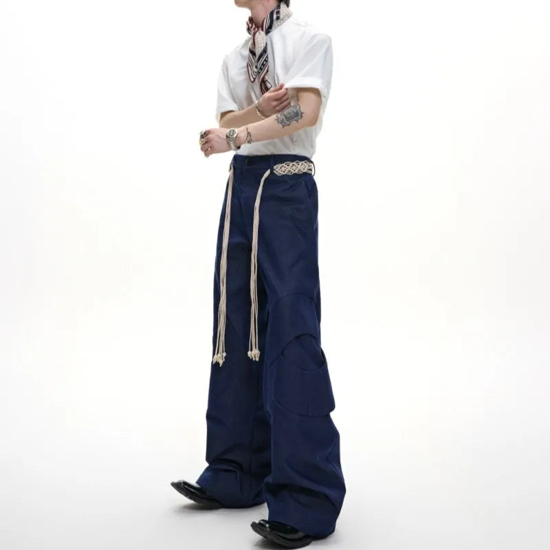 Men's dark blue loose straight-leg trousers with heavy 3D stitching and zipper decorations.