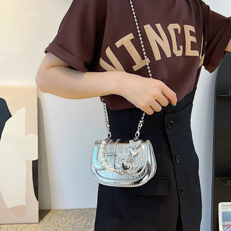 Women's PU leather mini tote crossbody bag in saddle silhouette with single shoulder strap