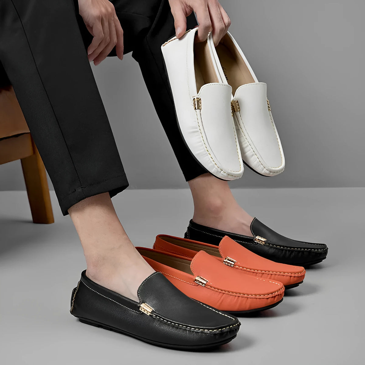 Men's leather driving shoes in black, white, or orange with flat wedge heel, round toe, and sewn rubber sole, sizes 38 to 47