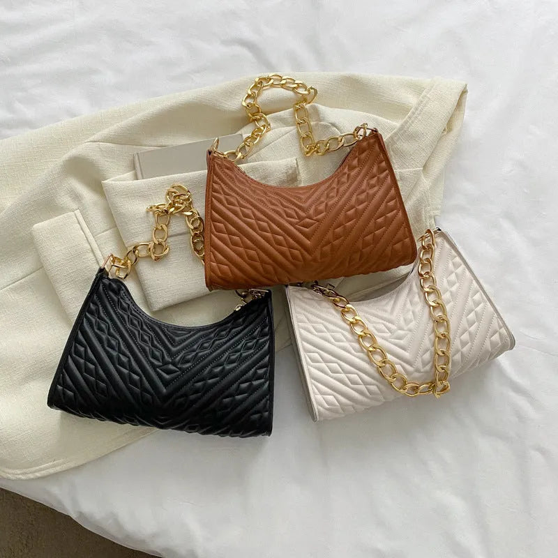 Brown pleated chain shoulder bag with square shape and adjustable metal strap