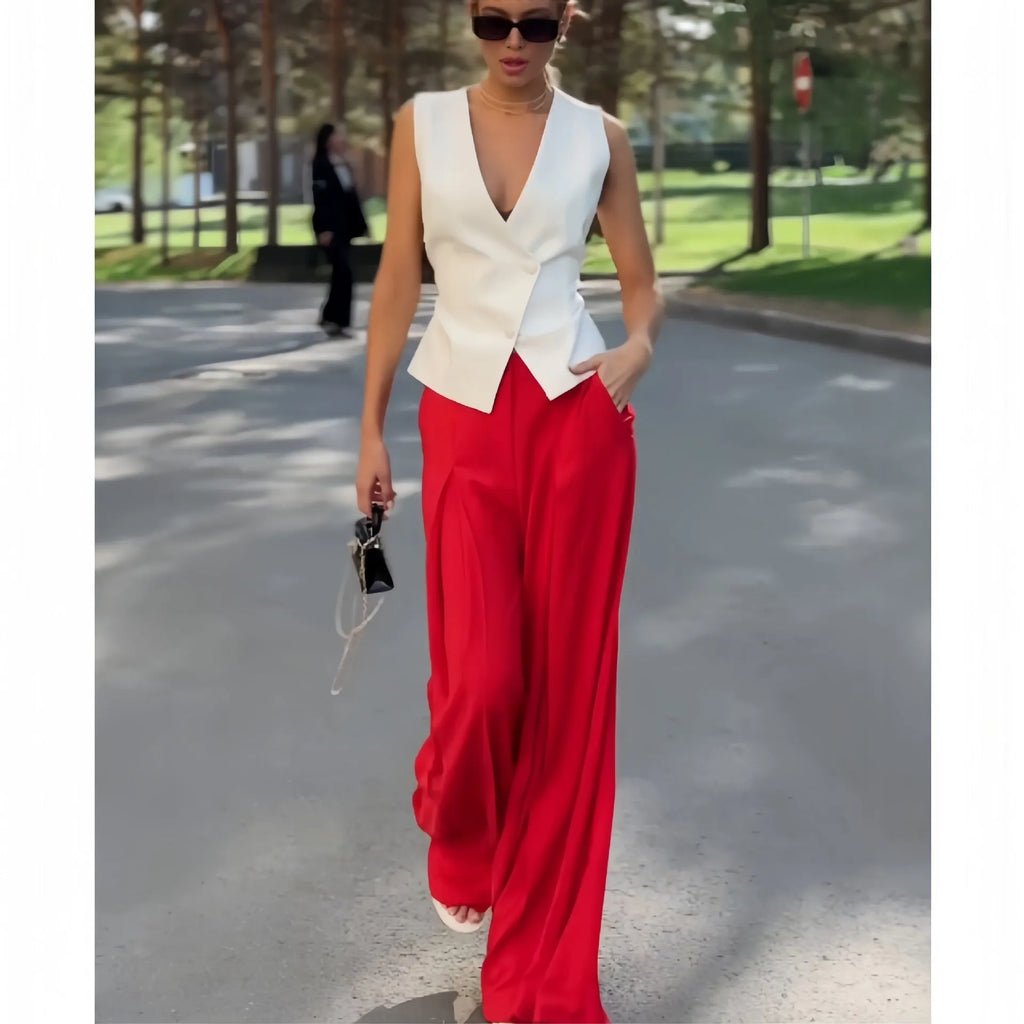 Women's beige two-piece set with sleeveless deep V-neck top and high-waisted wide-leg trousers