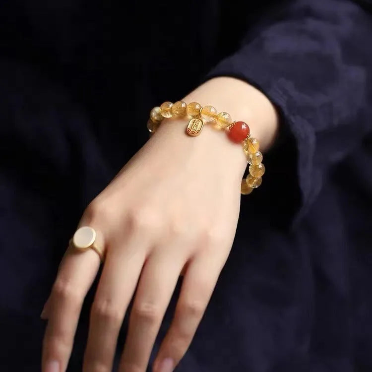 Polished natural red agate beaded bracelet showing stone texture and bead proportion