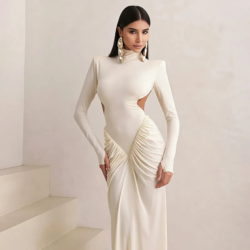A woman's long sleeve high collar slim fit pleated backless formal dress in a solid colour.