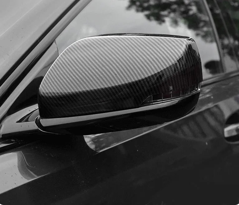 Pair of black ABS rearview mirror covers with carbon fibre pattern for Cadillac CT5 CT6.