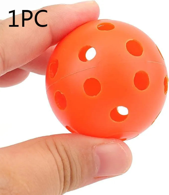 Multi-colour 42mm polyethylene golf practice balls in a net bag.