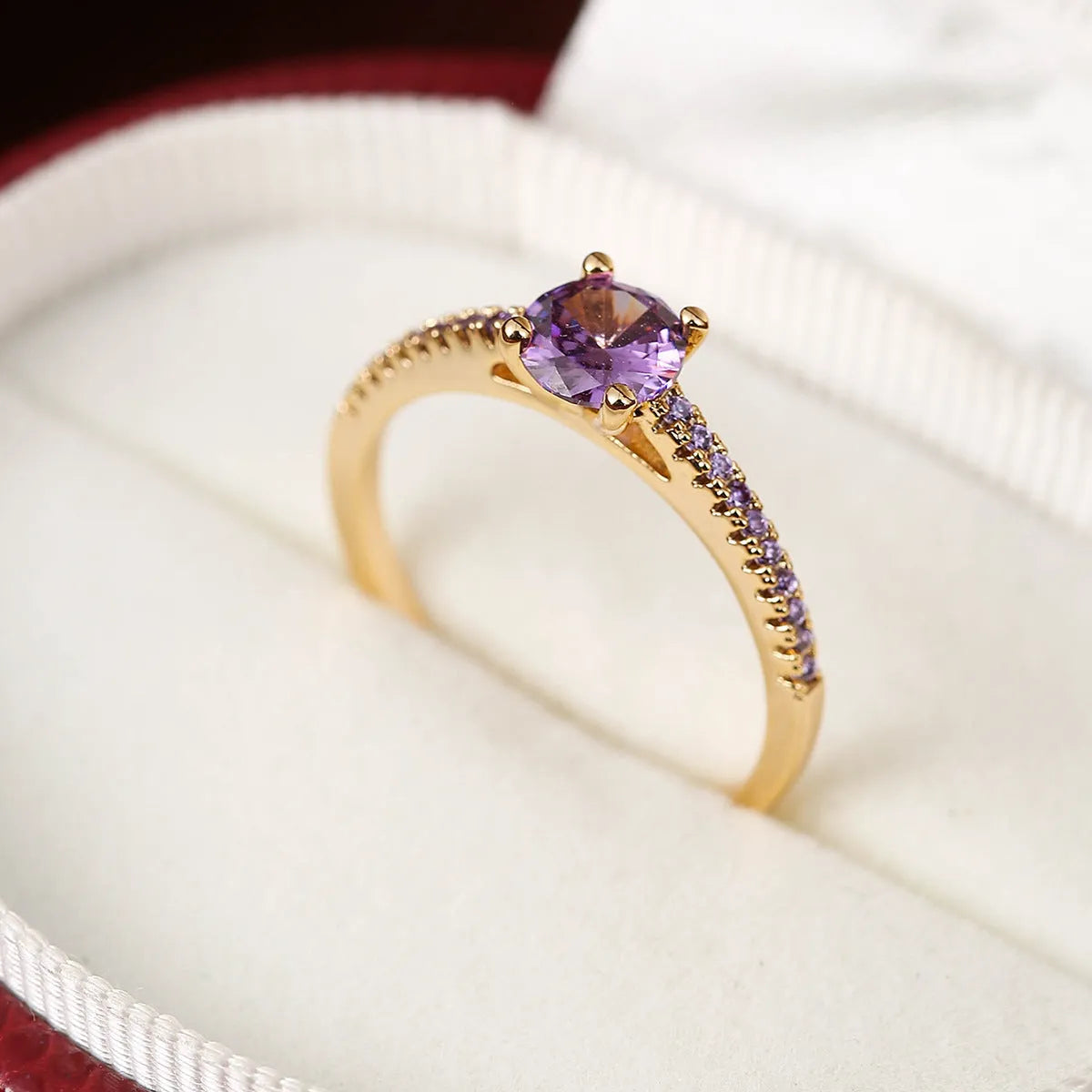 Copper zircon hexagonal geometric ring in a gold rose red electroplated finish.