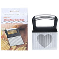 Stainless steel potato wave knife with a wavy blade on a wooden cutting board next to a potato.