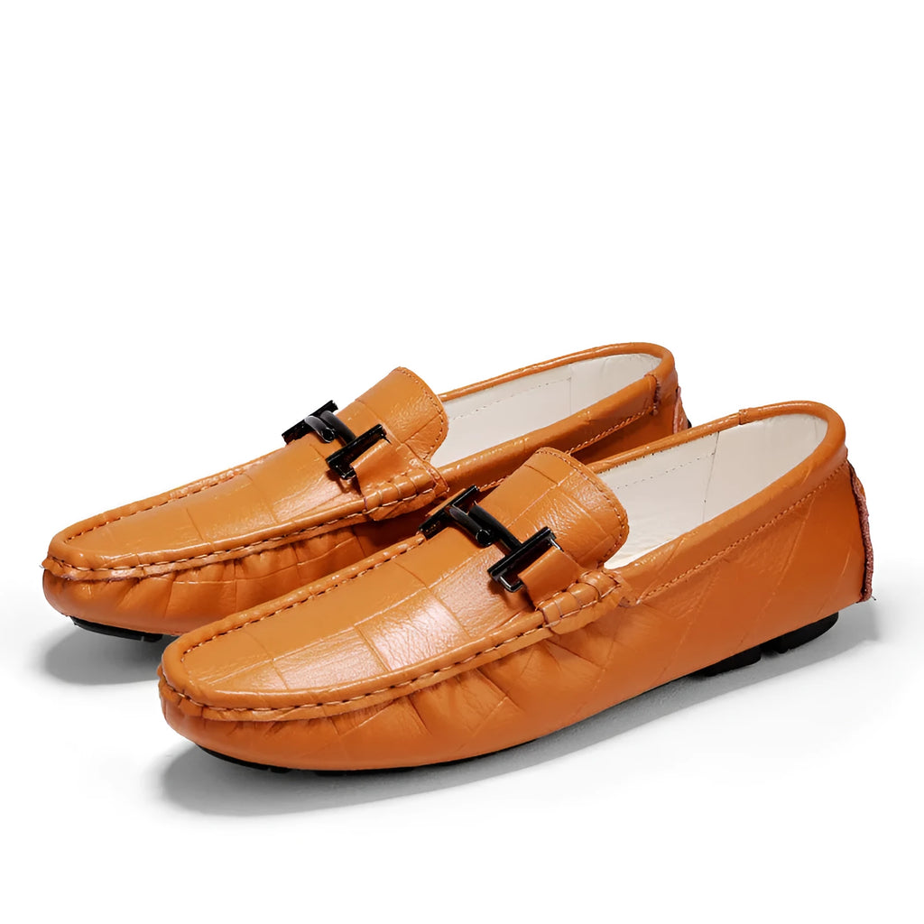 Men's brown leather derby brogues with buckle detail and lace-up closure on flat rubber sole