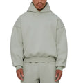 A man wearing a solid colour fleece-lined cotton hoodie with a wool lining.