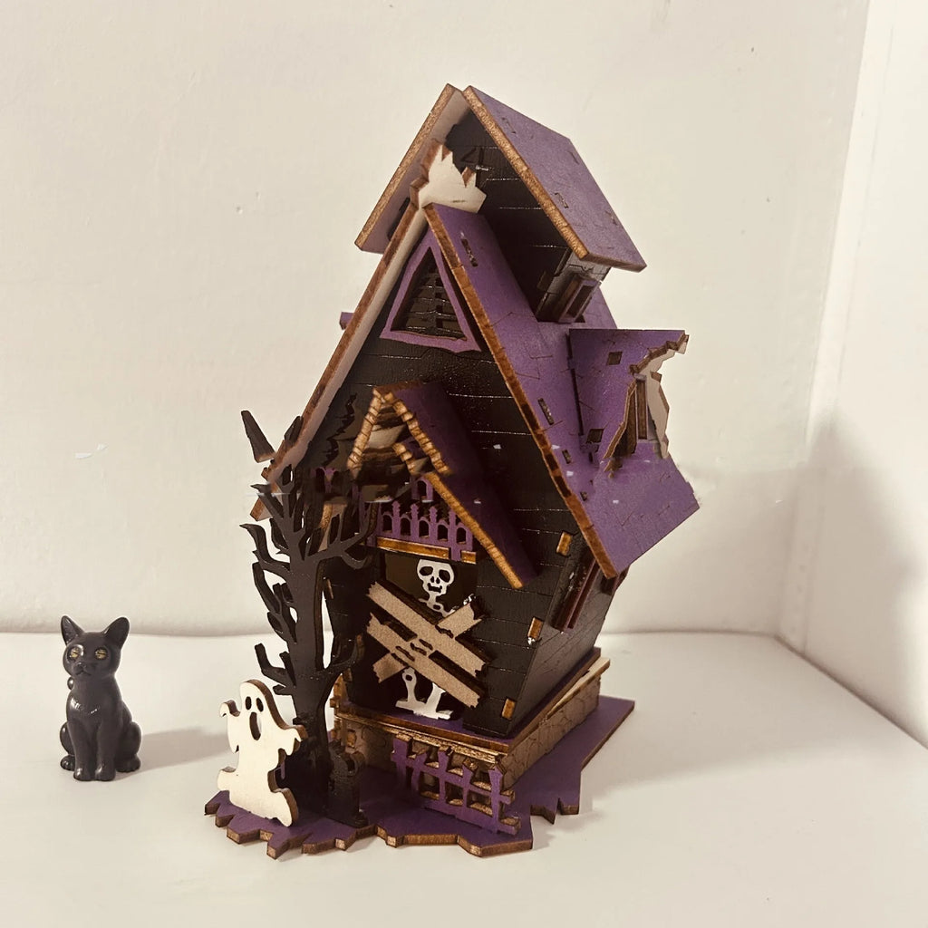 Wooden DIY glowing haunted house Halloween table decoration with luminous details