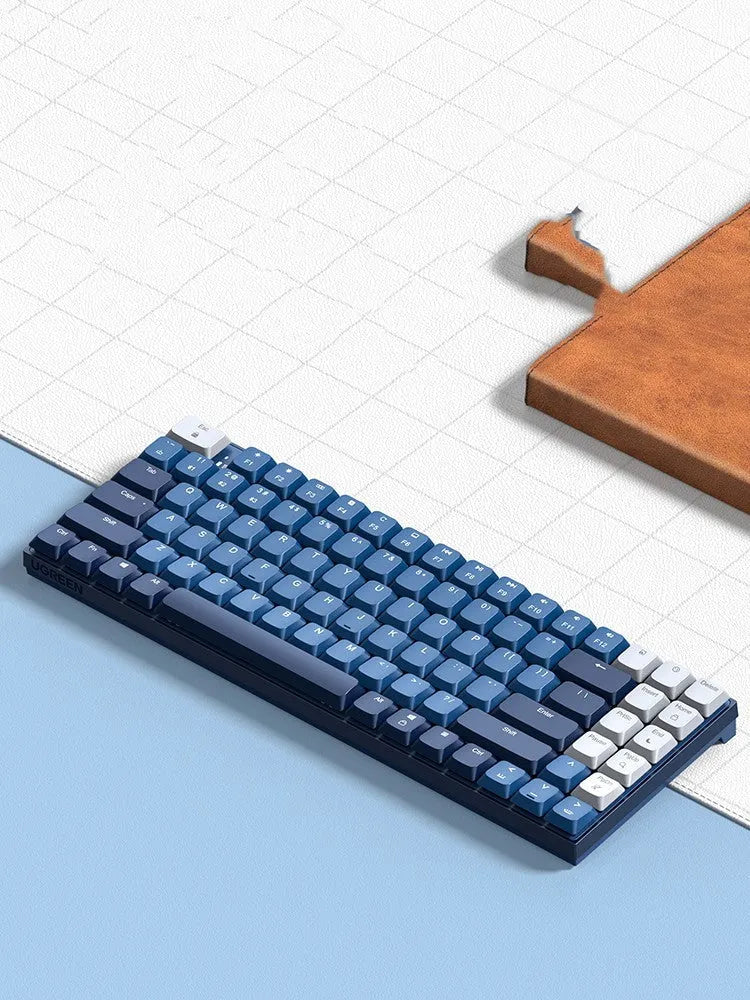 Ku102 mechanical keyboard in Deep Sea Blue with monochrome backlit keys and tea axis switches