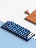 Ku102 mechanical keyboard in Deep Sea Blue with monochrome backlit keys and tea axis switches