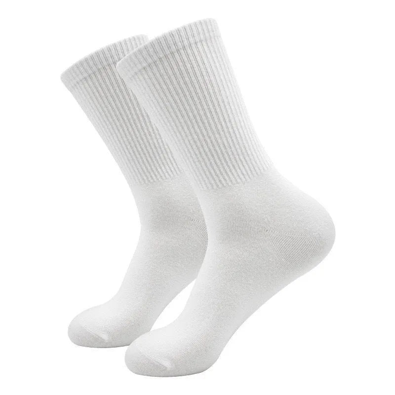 Mid-calf length sports socks in black, white, and grey colours