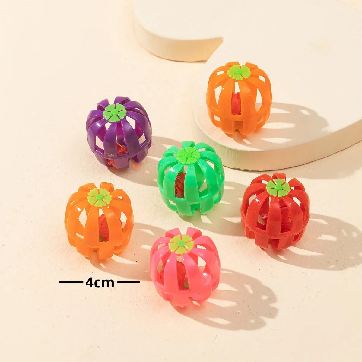 Colored plastic bell mesh hollow sound cat teasing ball in rainbow colour
