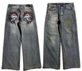 Grey washed-out men's wide-leg jeans with a retro worn look on a mid waist.