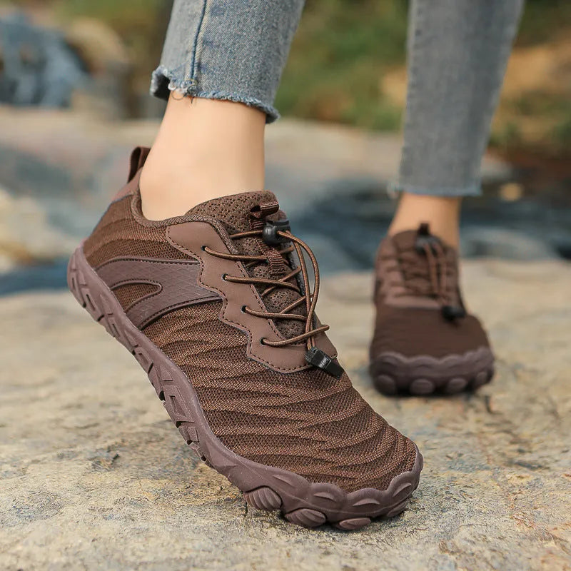 Low-top outdoor hiking shoes with mesh lining and rubber sole in multiple colours.
