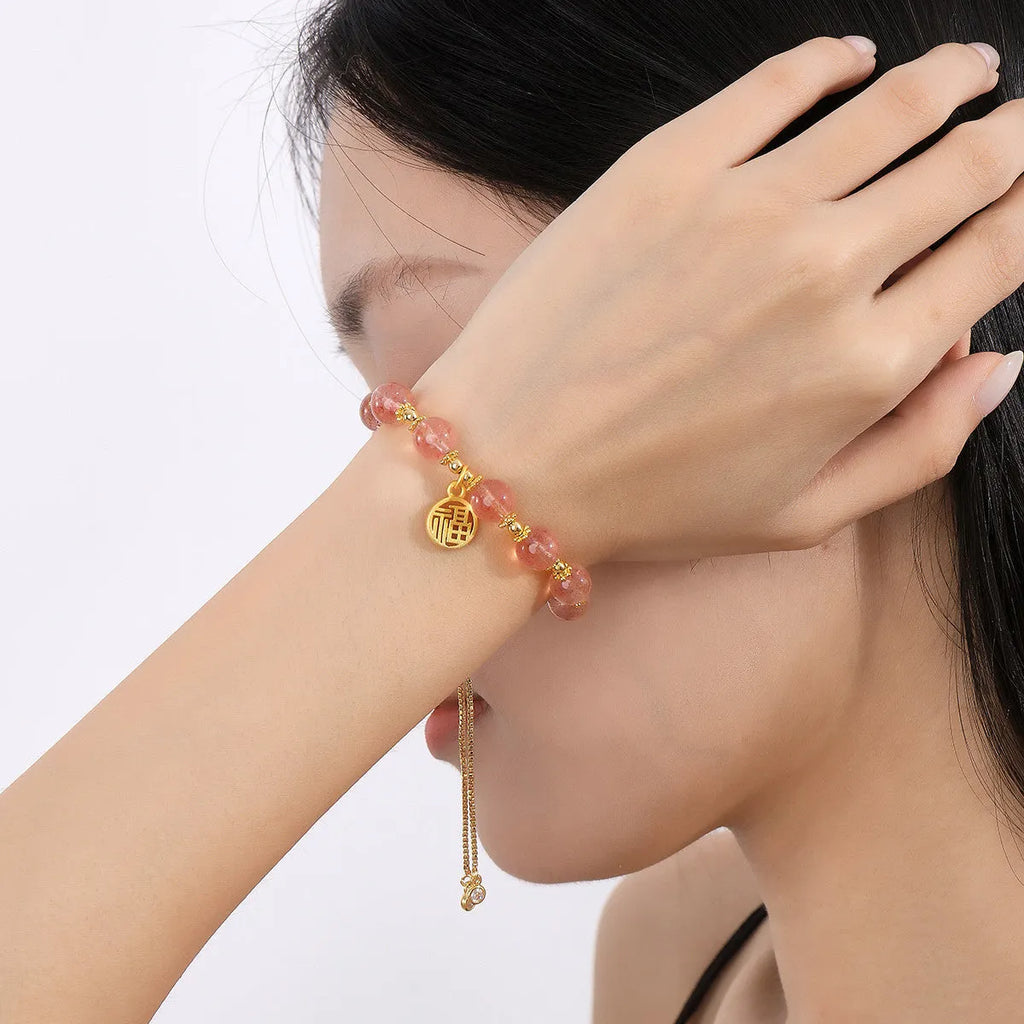 Strawberry quartz crystal bracelet with geometric fu character design and electroplated finish