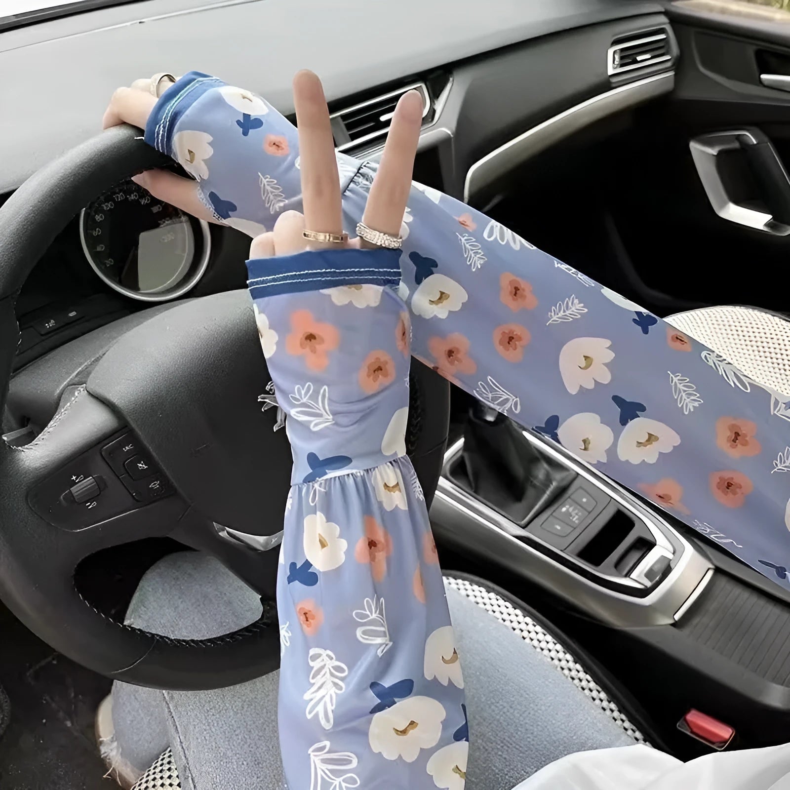 Printed ice silk fabric sun protection oversleeve gloves in a leaf and flower pattern.