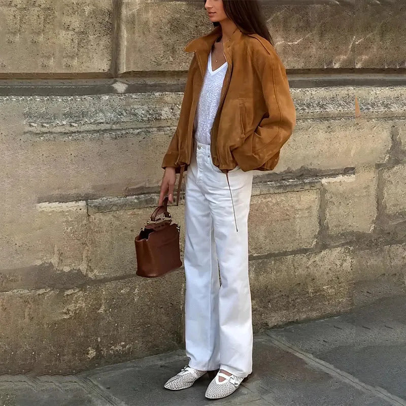 Retro solid colour loose-fit polyester jacket with long sleeves on a hanger.