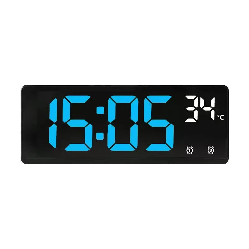 Electronic alarm clock with large LED screen showing time and temperature on desktop