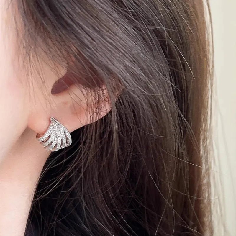 A pair of women's geometric drop earrings in a platinum colour, made from zircon with an electroplated finish.