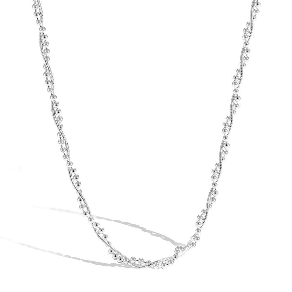 925 sterling silver geometric pendant necklace with electroplated silver finish on woman