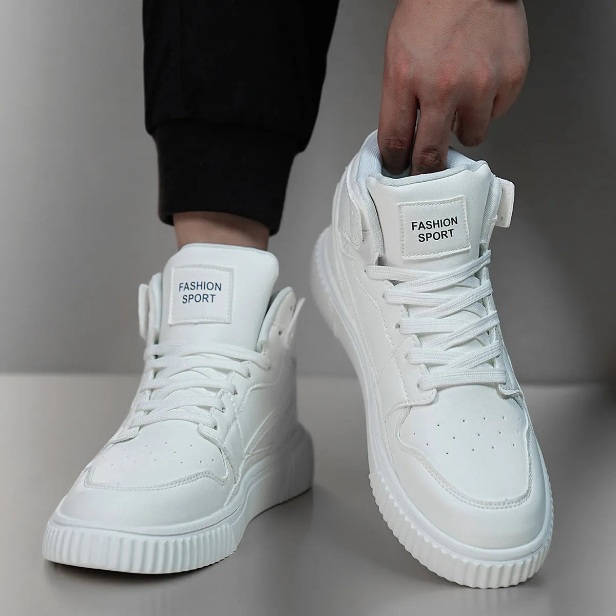 Men's solid white casual shoe with a round toe and smooth microfiber upper.