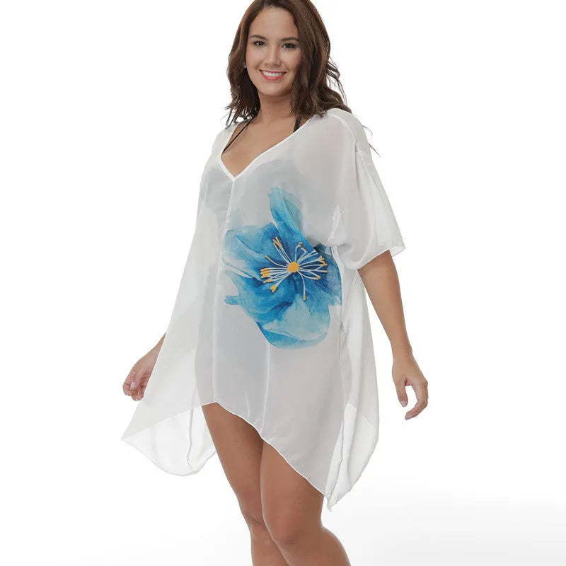 White plus-size loose beach cover-up blouse for women on a hanger.