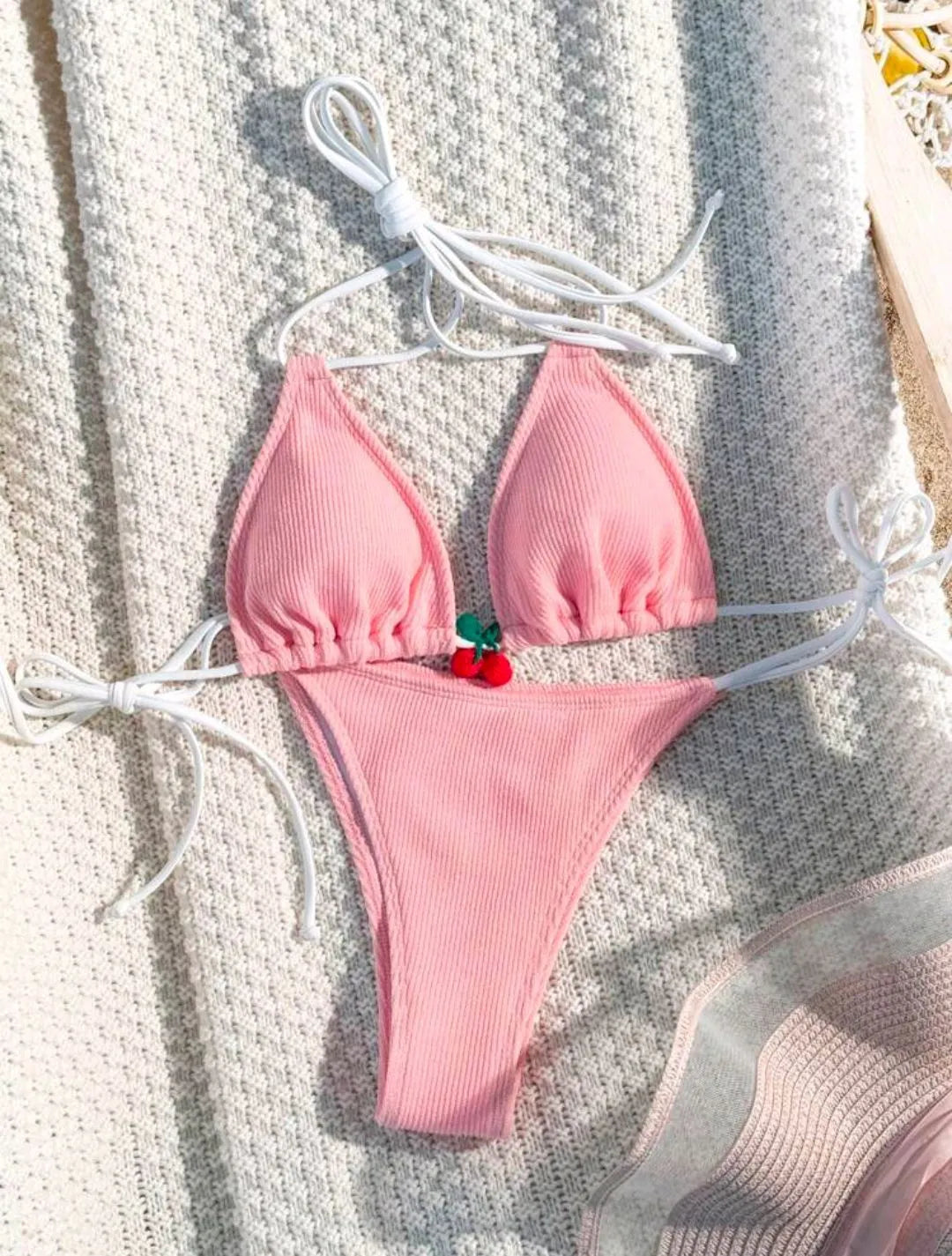 Women's bikini swimsuit set in a briefs style, shown in one of five solid colours: apricot, matcha, orange, pink, or white.