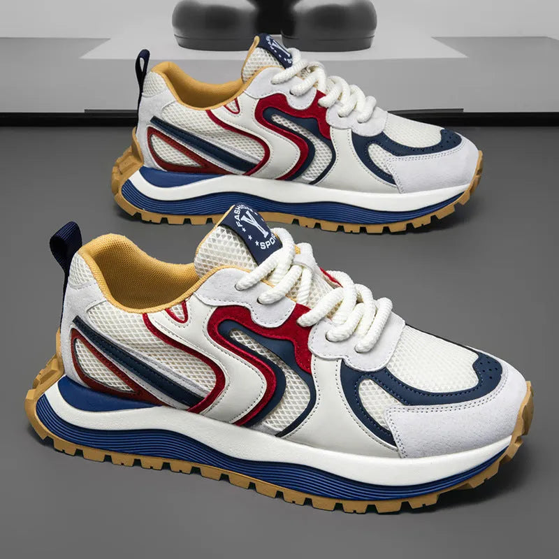 Men's casual sneaker in synthetic leather and mesh, showing round toe and lace-up front.