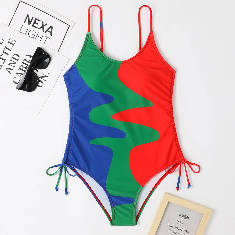 Women's sleeveless backless one-piece swimsuit in blue, purple, brown, or green.