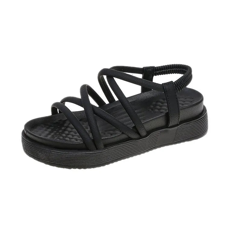 Women's black Roman-style platform sandals with a round toe and slip-on sleeve design.