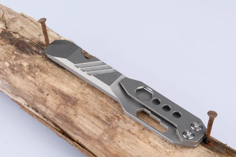 Titanium alloy multi-function crowbar tool with bottle opener and screwdriver, in gun grey finish.